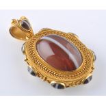 A 19th CENTURY 18ct GOLD AGATE LOCKET PENDANT