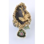 AN UNUSUAL BEJEWELLED 18CT GOLD HEMATITE DIAMOND A