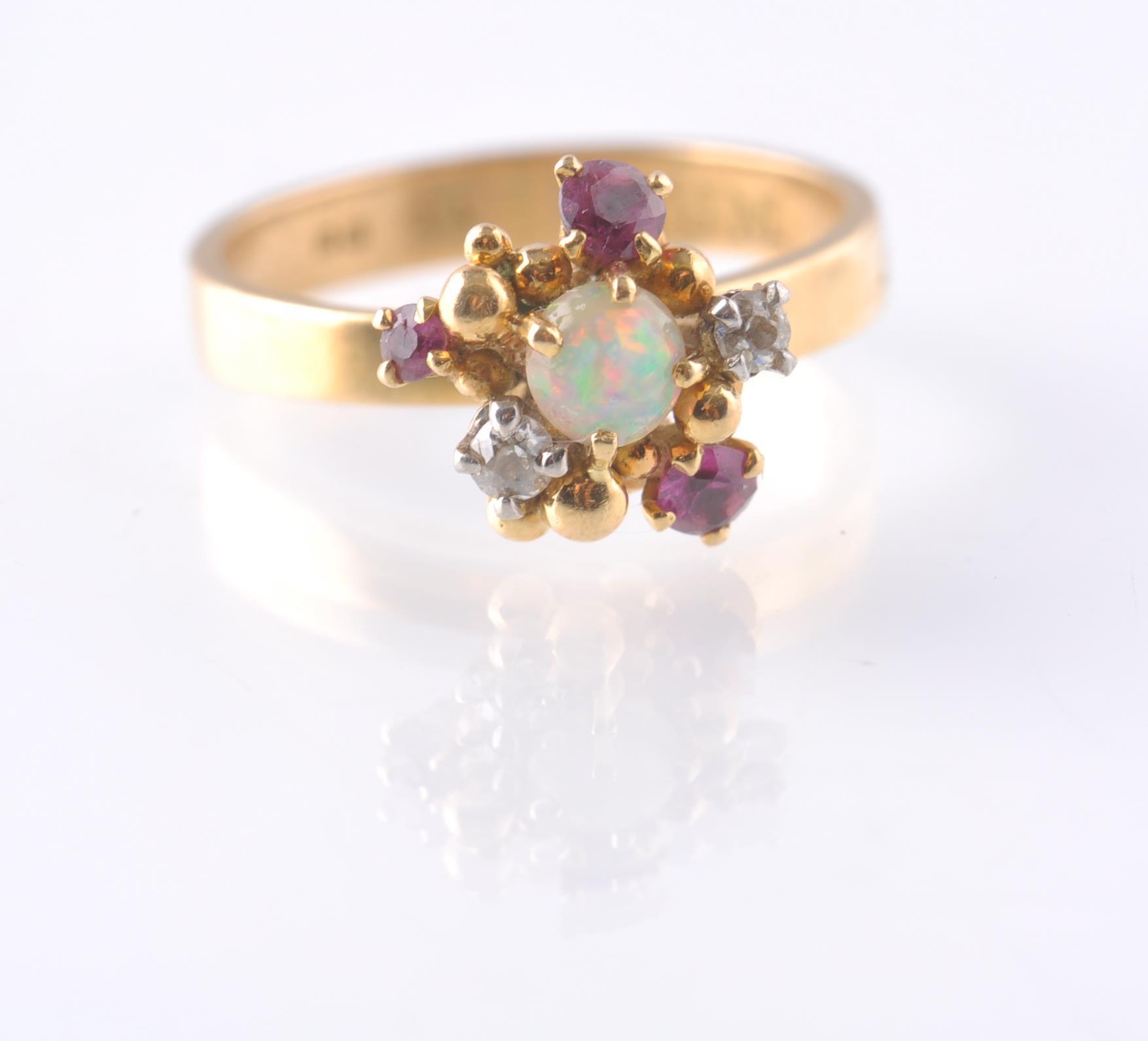 A HALLMARKED OPAL RUBY AND DIAMOND CLUSTER RING