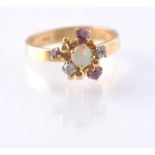 A HALLMARKED OPAL RUBY AND DIAMOND CLUSTER RING