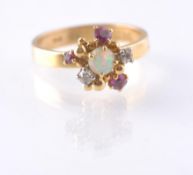 A HALLMARKED OPAL RUBY AND DIAMOND CLUSTER RING