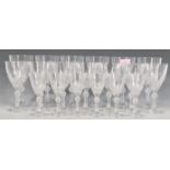 A collection of cut lead crystal drinking glasses