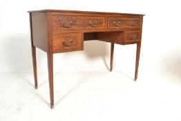 An early 20th Century mahogany desk having squared