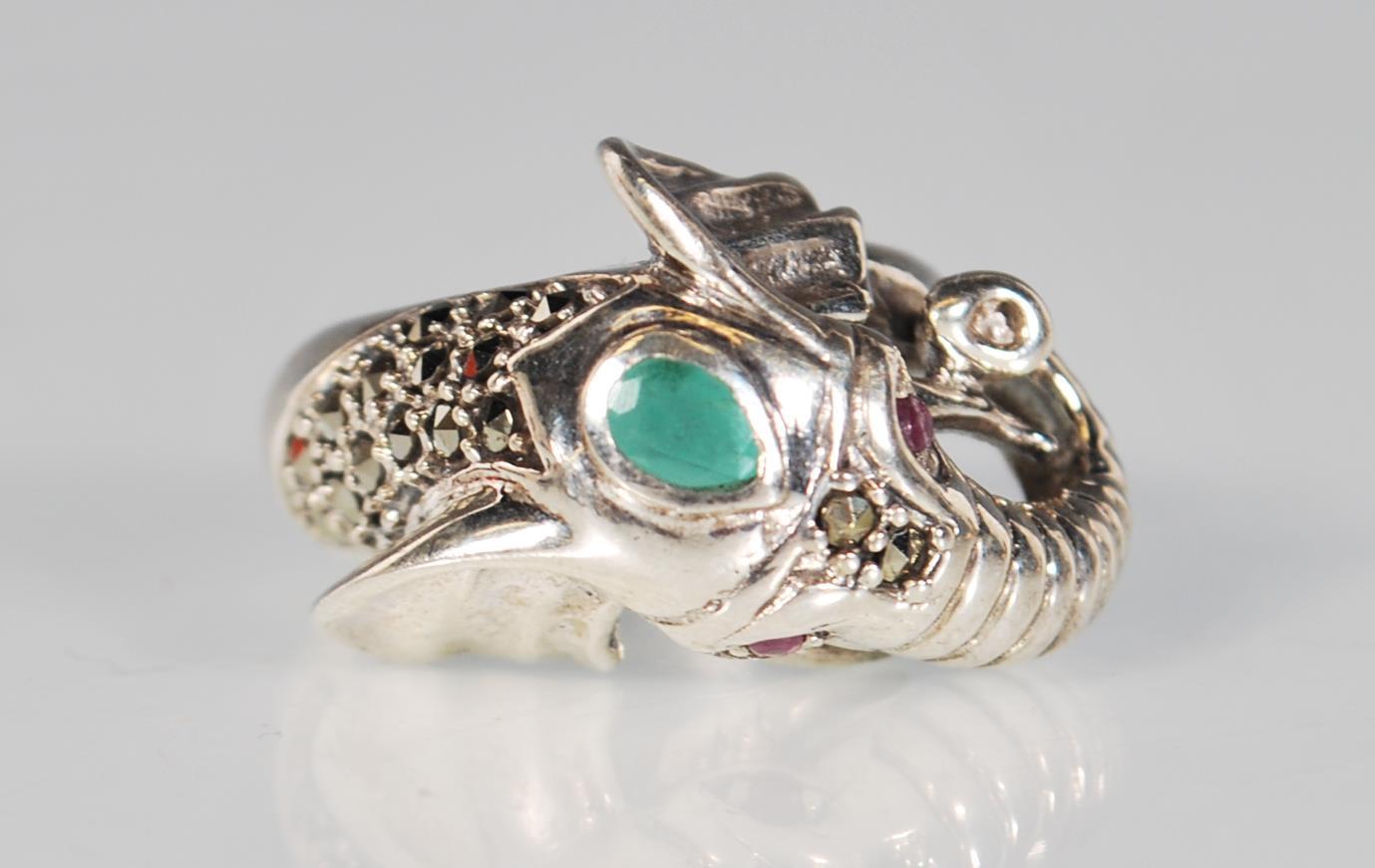 A silver and marcasite ring in the form of an elep
