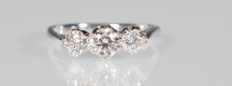 An 18ct white gold ring set with a central diamond