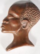 A 20th Century African bronze cameo wall plaque in