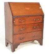 An Edwardian mahogany inlaid bureau desk being rai