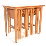 A vintage mid 20th Century teak side - nest of tab