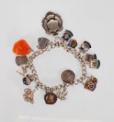 An English hallmarked charm bracelet having a curb