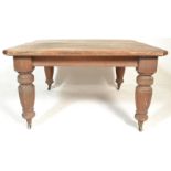 A 19th Century Victorian oak extending dining tabl