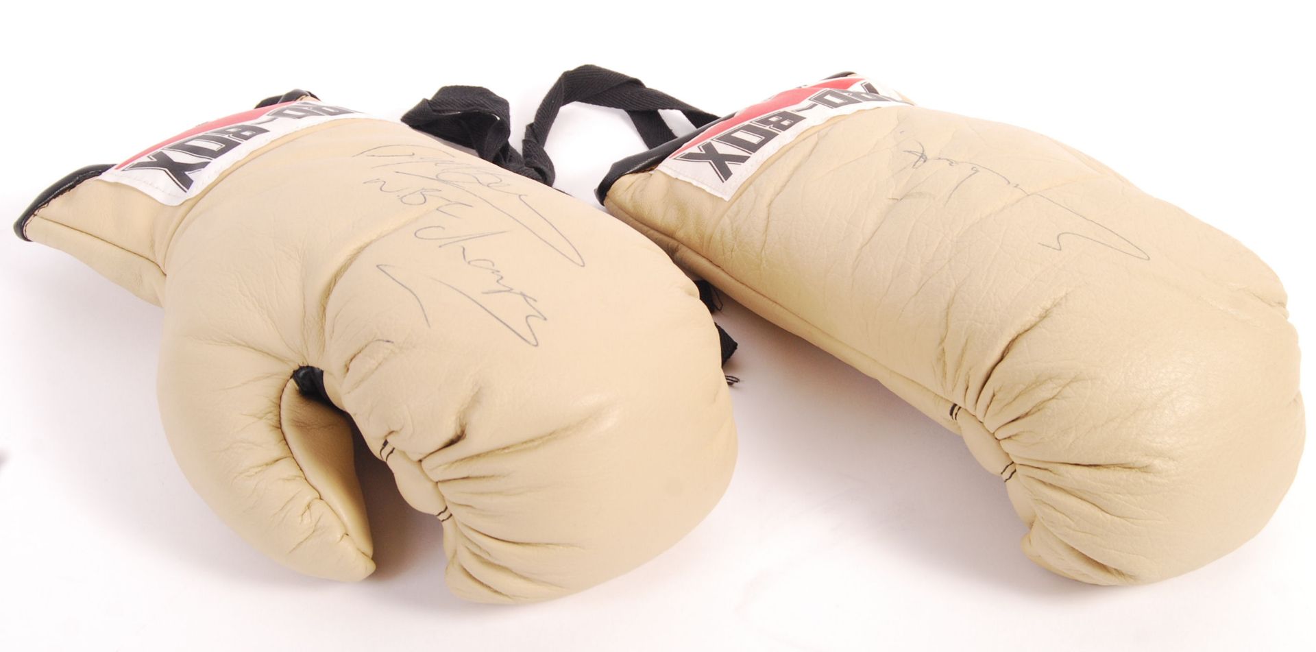 BOXING GLOVES SIGNED BY CHRIS EUBANK AND NIGEL BENN