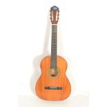 A vintage 20th Century six string acoustic six string classical Spanish style guitar, ebonised
