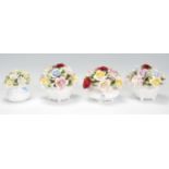 A collection of Royal Doulton porcelain flower baskets. Each basket in white glaze with encrusted