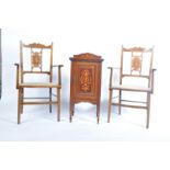 An Edwardian mahogany and marquetry inlaid pot cupboard raised on square tapering legs with spade