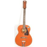 A good 12 string Eko acoustic guitar complete with carry case. The guitar with label to inside.