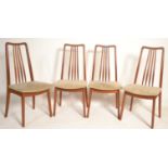 A set of four retro Danish manner 20th Century teak wood rail back dining chairs, drop in