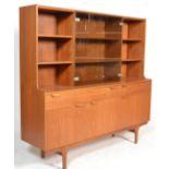 A retro 20th Century highboard / sideboard / display having a configuration of shelves and cupboards
