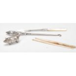A collection of silver hallmarked and white metal items to include a white metal match vesta in