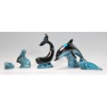 A collection of Poole pottery figurines to include a large dolphin, a whale, a seal, an otter and