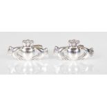 A pair of stamped 925 silver cufflinks having Irish Claddagh design knots. Weight 9.6g.