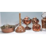 A group of copper kettles dating from the 19th Century Victorian era, some on stands with one having
