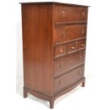 A Stag mahogany ' minstrel ' pattern tallboy chest of drawers. Raised on squared legs with 3 short