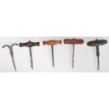 A group of cork screws dating from the 19th Century to include turned examples, a rosewood handled