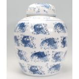 A large Kang-xi blue and white Chinese ginger gar decorated with repeating pattern of fish / carp.