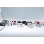A collection of modern digital cameras to include makes and models from Kodak Easy Share CX4300,