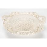 An Irish Belleek porcelain basket having applied florals to rim in the form of roses, thistles and
