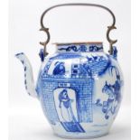 A large 19th Century Chinese blue and white teapot having a bronze carrying handle. The bulbous body