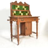 A 19th Century Victorian mahogany washstand having a marble top with majolica tiled splash back with