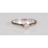 An English hallmarked 18ct white gold and diamond solitaire ring prong set with a brilliant cut
