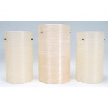 A group of three vintage retro 20th Century fibreglass spun light / lampshades in a neutral