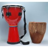 A 20th Century large Headliner tom-tom drum, red body fitted with carry straps together with an