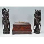 A pair of early 20th Century Japanese carved hardwood figurines of elders inlaid with silver wire