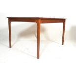 A vintage 20th century retro teak wood dining table by Mcintosh of Kirkcaldy, Scotland. Raised on