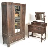 A 1920's Jacobean revival geometric moulded front single wardrobe and matching dressing table.
