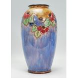 A 20th century Royal Doulton tube line vase have drip glaze decoration of two tone colourway