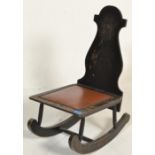 A 19th century hand painted wooden folk art rocking chair. The angular wooden painted frame with