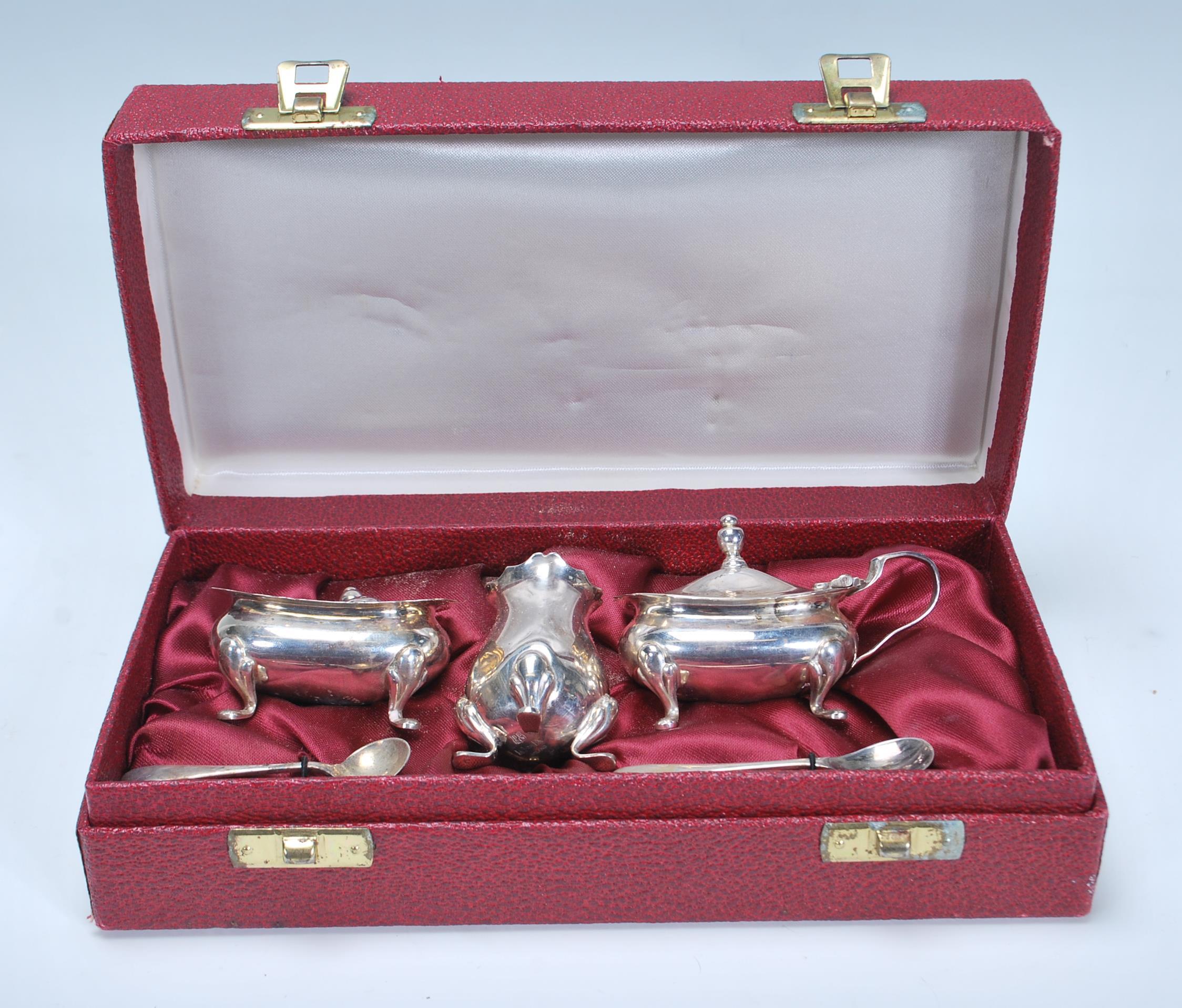A 20th Century Barker Brothers silver cruet set consisting mustard pot, pepperette, and table sale