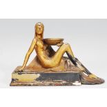 A 1920's / 1930's Art Deco cast metal mantel piece ornament in the form of a seated female