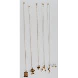 A group on 9ct gold necklaces and chains to include one having a knife, fork and spoon pendant,