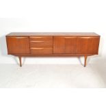A retro 20th Century Stonehill Furniture teak wood sideboard credenza, bank of three drawers with