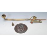 A late 19th / early 20th Century Chinese brass opium pipe together with another smaller brass