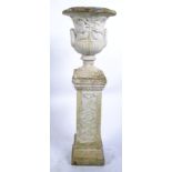 A  good 20th Century reconstituted well weathered stone garden pedestal urn planter, the campagne