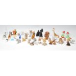 A collection of Wade Whimsie figurines to include Lady, animals together with other similar style