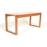 A 20th century retro vintage Danish inspired teak wood coffee table of rectangular form with