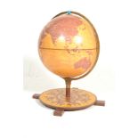 A retro style contemporary floor terrestrial globe by Zoffoli having a sundial compass design to