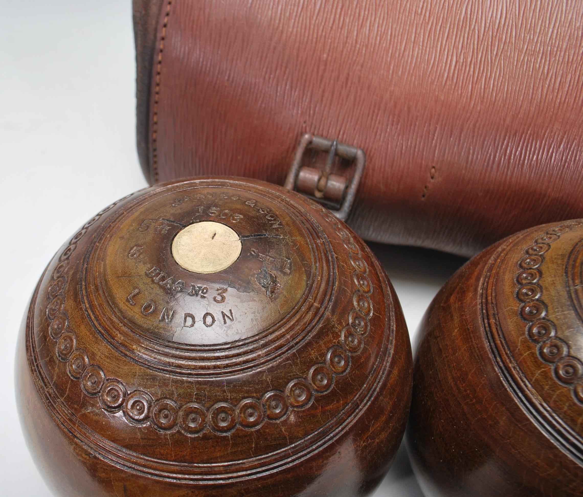 Crown Green Bowls - A set of three early 20th century vintage lignum vitae bowling bowls, in - Image 6 of 6